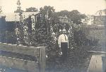 А.Б. Рудобельский в своем саду около цветущих мальв. 1924 г. Из альбома Антонины Алексеевны Рудобельской